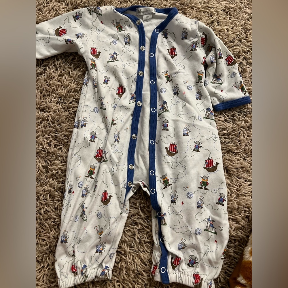 Kissy kissy onesie with Vikings print. Excellent used condition